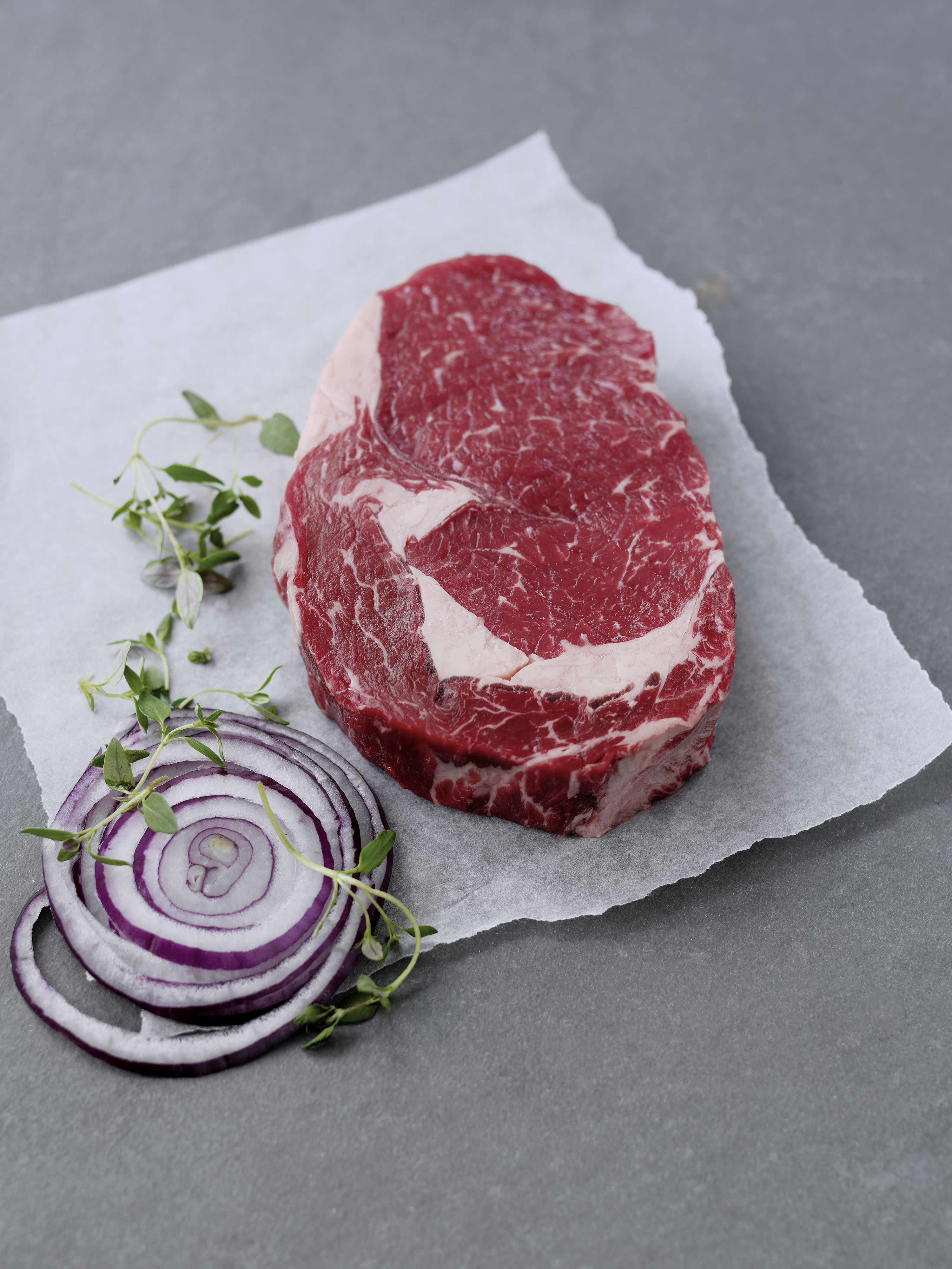 Raw rib-eye steak