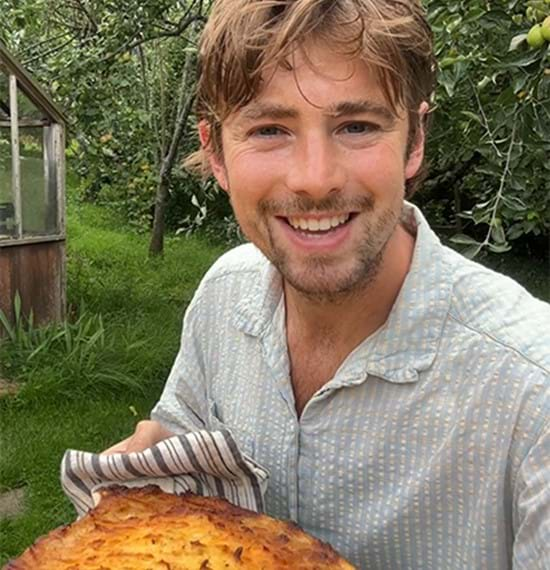 Shepherd's Pie in a dish on a wooden surface.