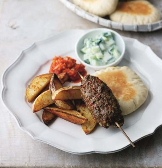 Kofta Kebabs served with Pitta Discs,Paprika Chips,Raita and Spicy Tomato Chutney